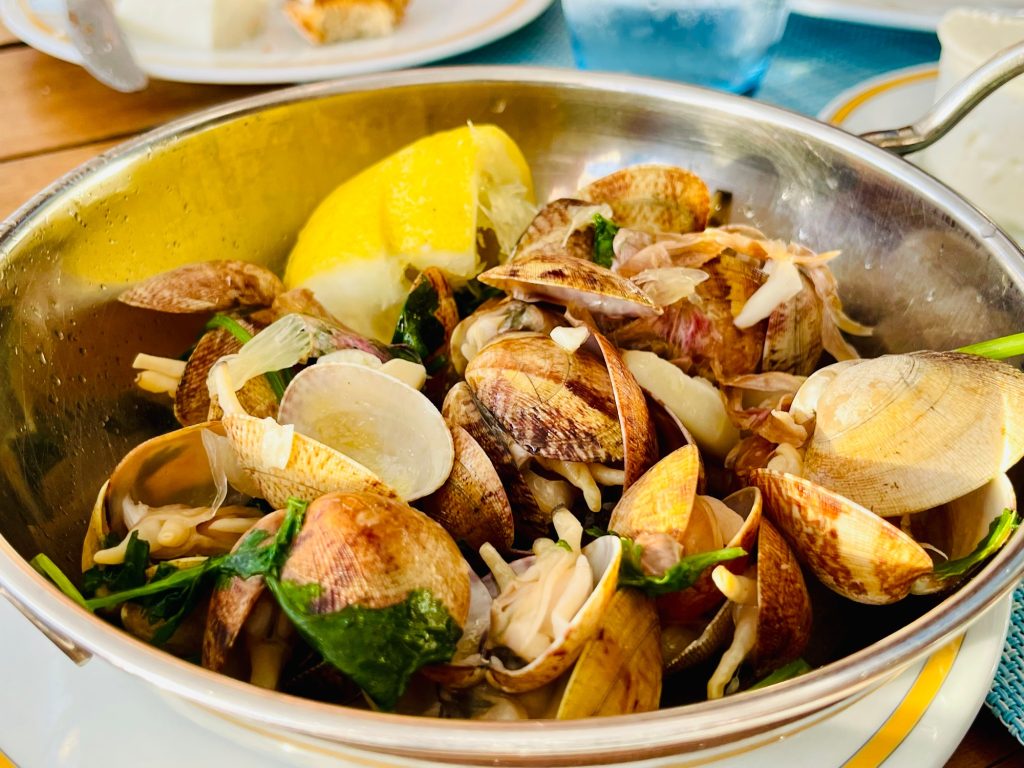 Clams in Garlic Sauce. Cooked clams with parsley,Mediterranean Cuisine