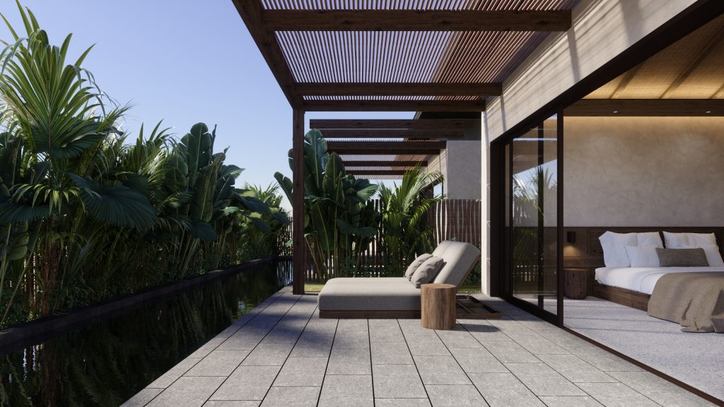 Moderne Hotelvilla mit Terrasse, Liege und kleinem Holztisch am Wasser, eingerahmt von tropischen Pflanzen und mit Blick ins offene Schlafzimmer mit großem Bett